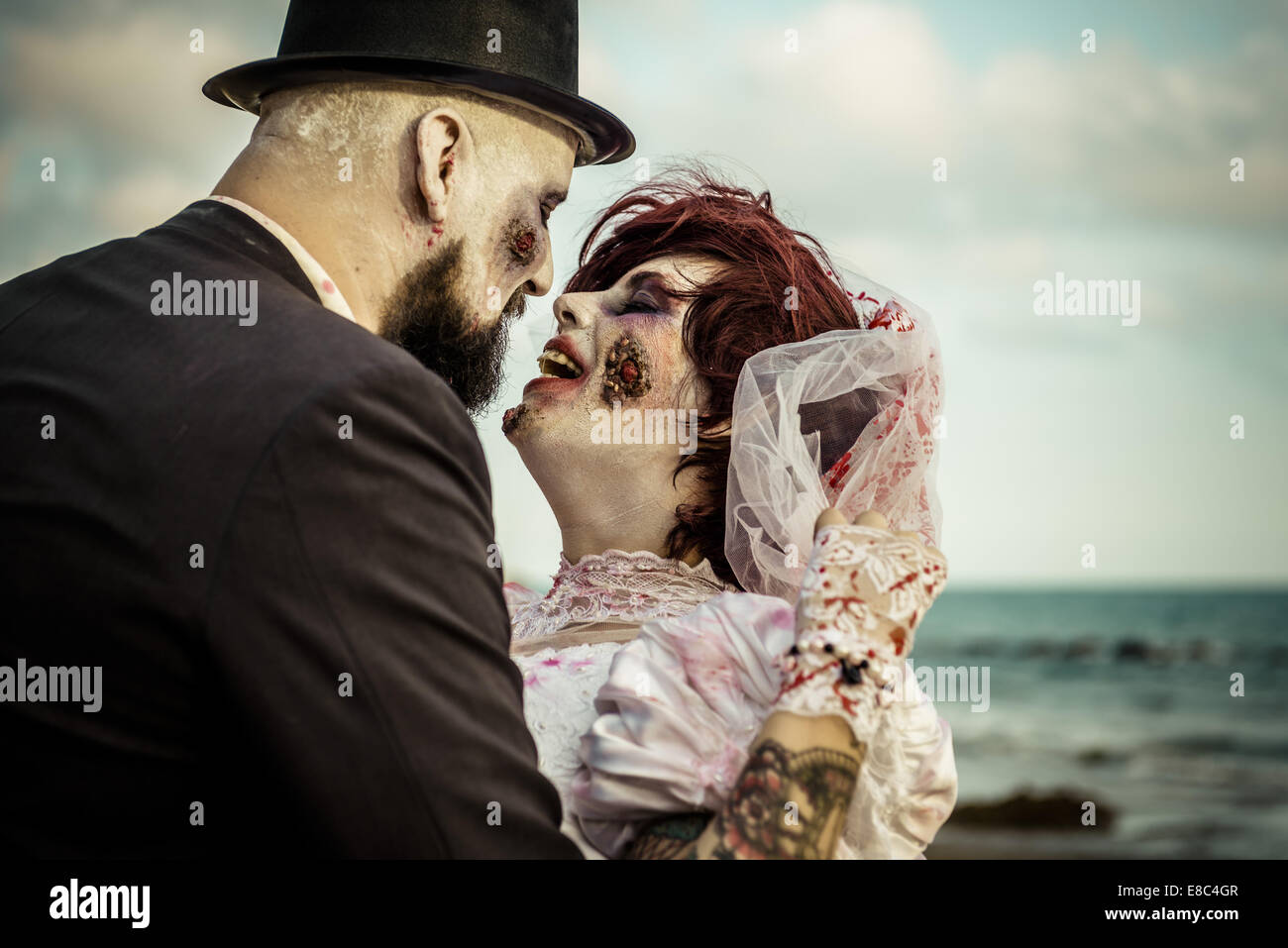 Sitges, Spain. 4th Oct, 2014. A couple dressed as a zombie bridal pair takes part in the Sitges Zombie Walk 2014 Credit:  Matthias Oesterle/ZUMA Wire/ZUMAPRESS.com/Alamy Live News Stock Photo
