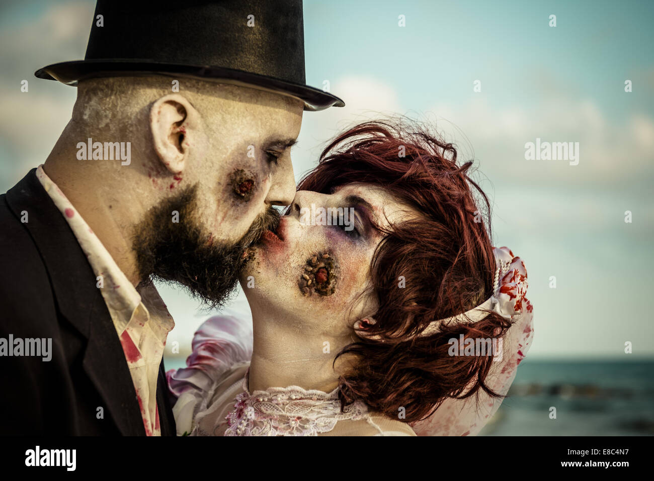 Sitges, Spain. 4th Oct, 2014. A couple dressed as a zombie bridal pair kisses each other in front of the Sitges Zombie Walk 2014 Credit:  Matthias Oesterle/ZUMA Wire/ZUMAPRESS.com/Alamy Live News Stock Photo