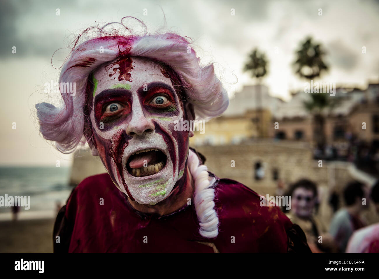 Sitges, Spain. 4th Oct, 2014. A man with a zombie makeup sticks out his tongue during the Sitges Zombie Walk 2014 Credit:  Matthias Oesterle/ZUMA Wire/ZUMAPRESS.com/Alamy Live News Stock Photo
