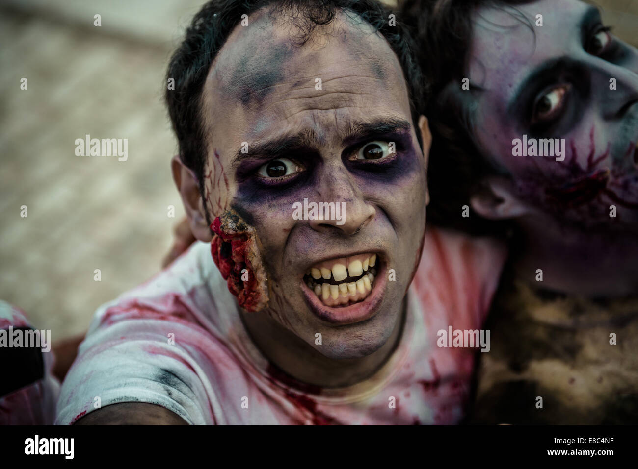 Sitges, Spain. 4th Oct, 2014. Zombies advance on the camera at the Sitges Zombie Walk 2014 Credit: Matthias Oesterle/ZUMA Wire/ZUMAPRESS.com/Alamy Live News Stock Photo