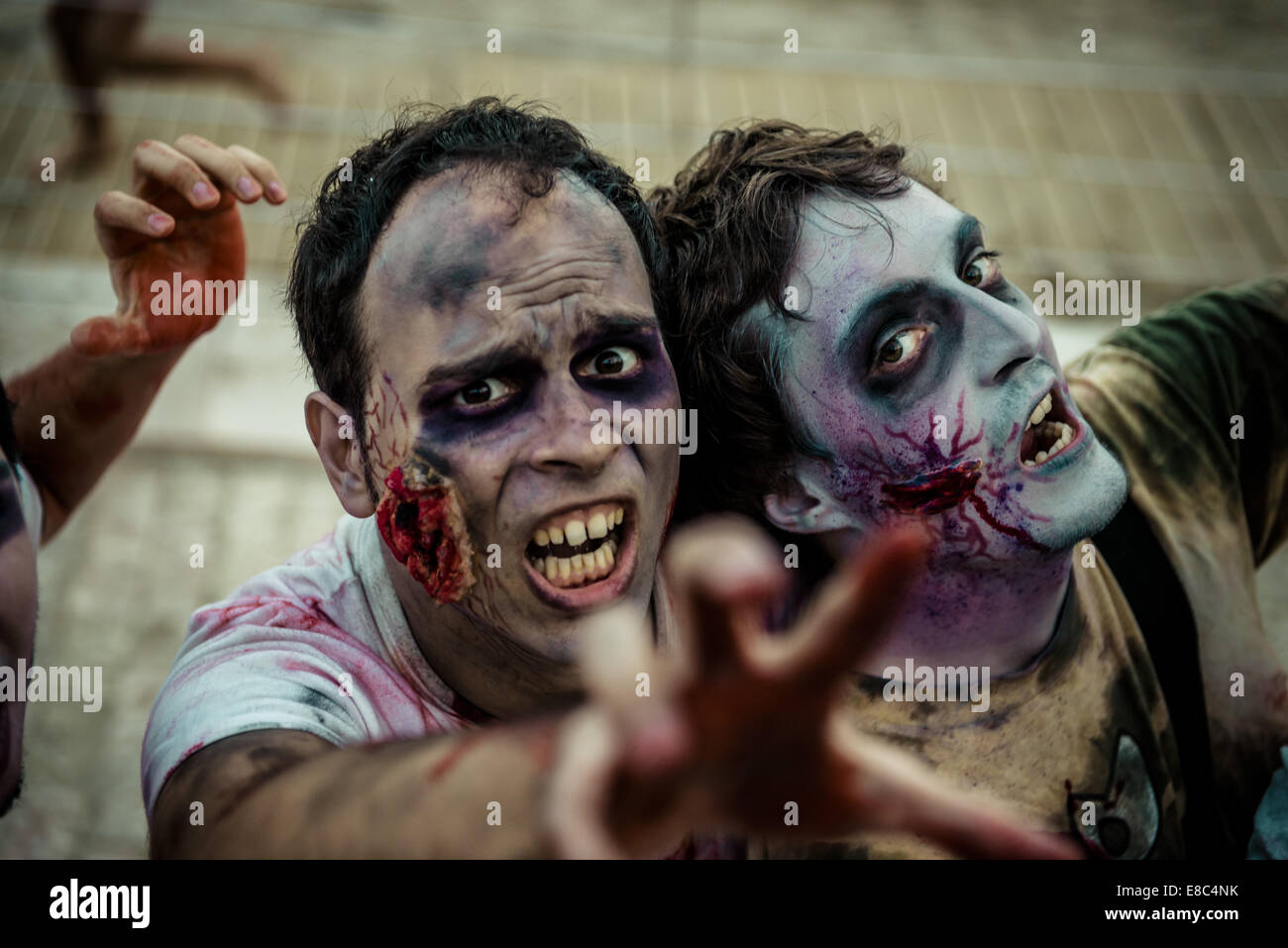 Sitges, Spain. 4th Oct, 2014. Zombies advance on the camera at the Sitges Zombie Walk 2014 Credit:  Matthias Oesterle/ZUMA Wire/ZUMAPRESS.com/Alamy Live News Stock Photo