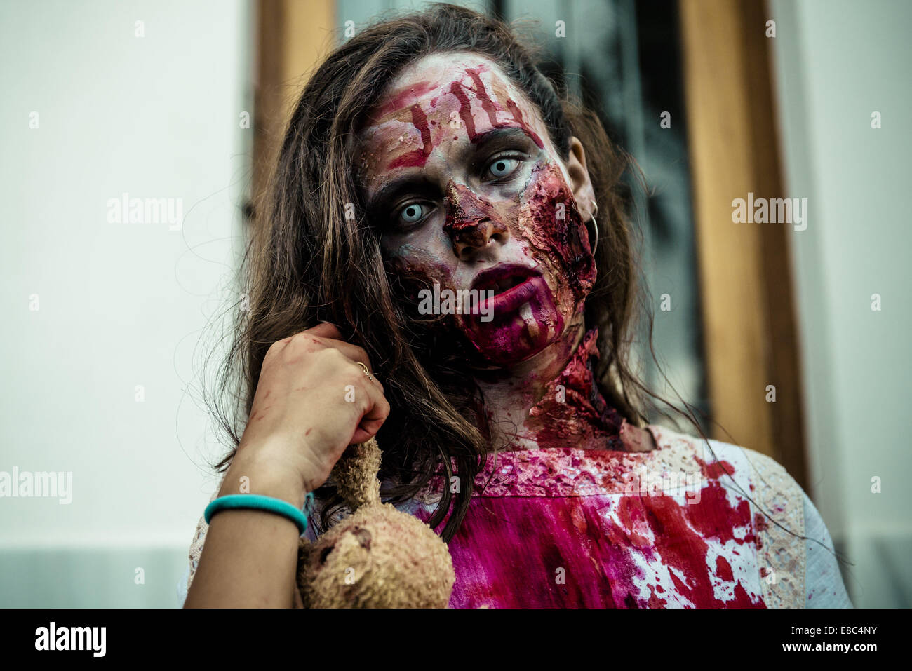 Sitges, Spain. 4th Oct, 2014. A girl made-up as a zombie takes part in the Sitges Zombie Walk 2014 Credit:  Matthias Oesterle/ZUMA Wire/ZUMAPRESS.com/Alamy Live News Stock Photo