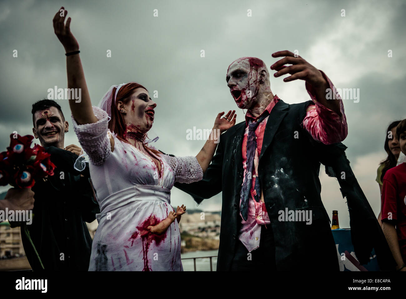 Sitges, Spain. 4th Oct, 2014. A couple dressed as a zombie bridal pair takes part in the Sitges Zombie Walk 2014 Credit:  Matthias Oesterle/ZUMA Wire/ZUMAPRESS.com/Alamy Live News Stock Photo