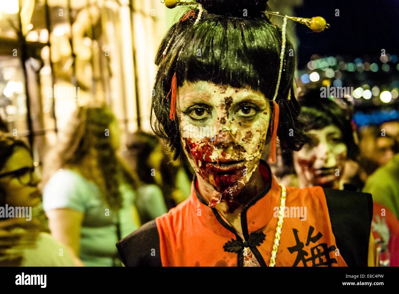 Sitges, Spain. 4th Oct, 2014. A woman in a Japanese costume is made-up as a zombie for the Sitges Zombie Walk 2014 Credit:  Matthias Oesterle/ZUMA Wire/ZUMAPRESS.com/Alamy Live News Stock Photo