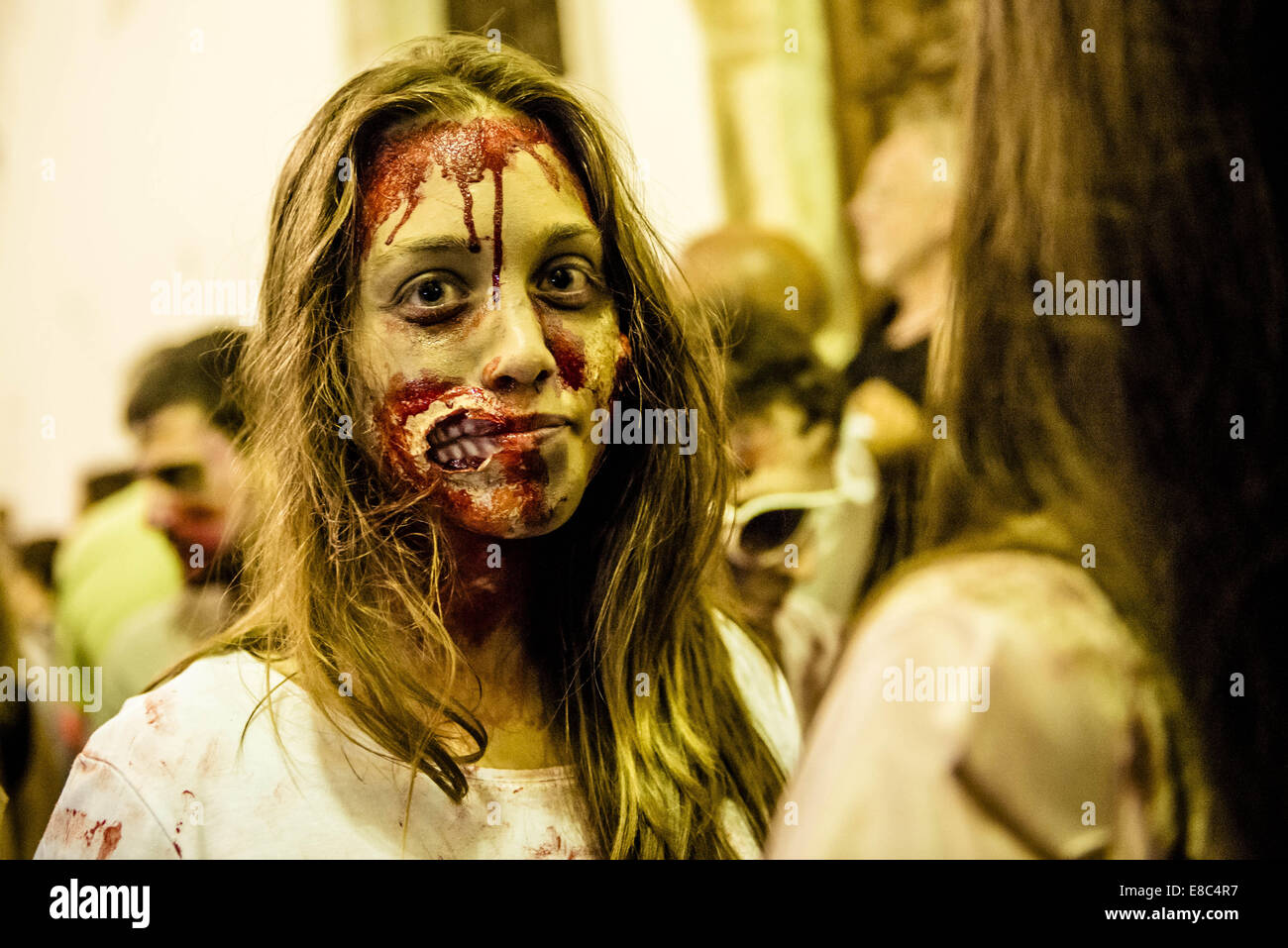 Sitges, Spain. 4th Oct, 2014. A girl made-up as a zombie takes part in the Sitges Zombie Walk 2014 Credit:  Matthias Oesterle/ZUMA Wire/ZUMAPRESS.com/Alamy Live News Stock Photo