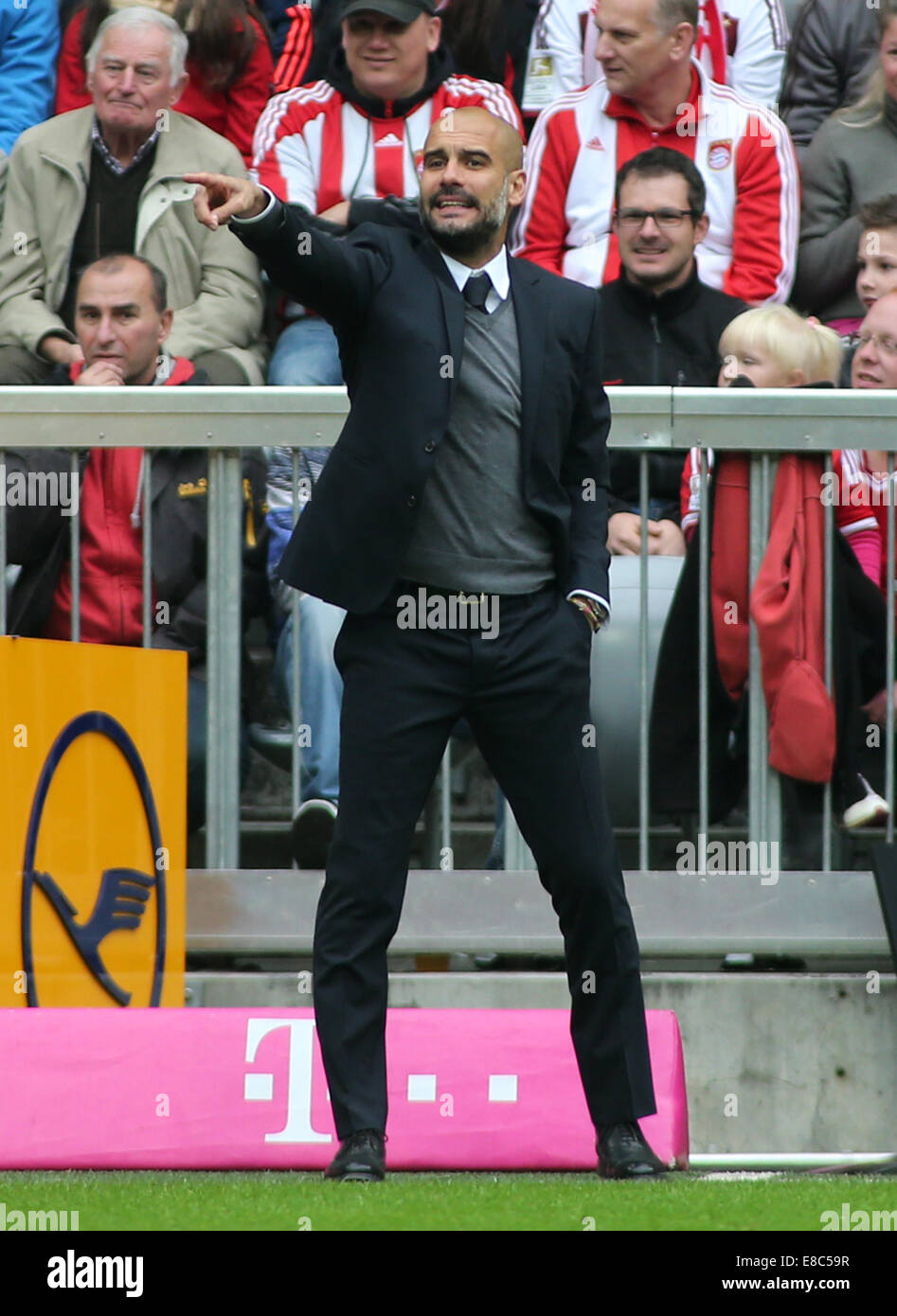 Beijing, Germany. 4th Oct, 2014. Bayern Munich's coach Josep Guardiola gestures during the German first division Bundesliga football match against Hannover in Munich, Germany, on Oct. 4, 2014. Bayern Munich won 4-0. Credit:  Philippe Ruiz/Xinhua/Alamy Live News Stock Photo