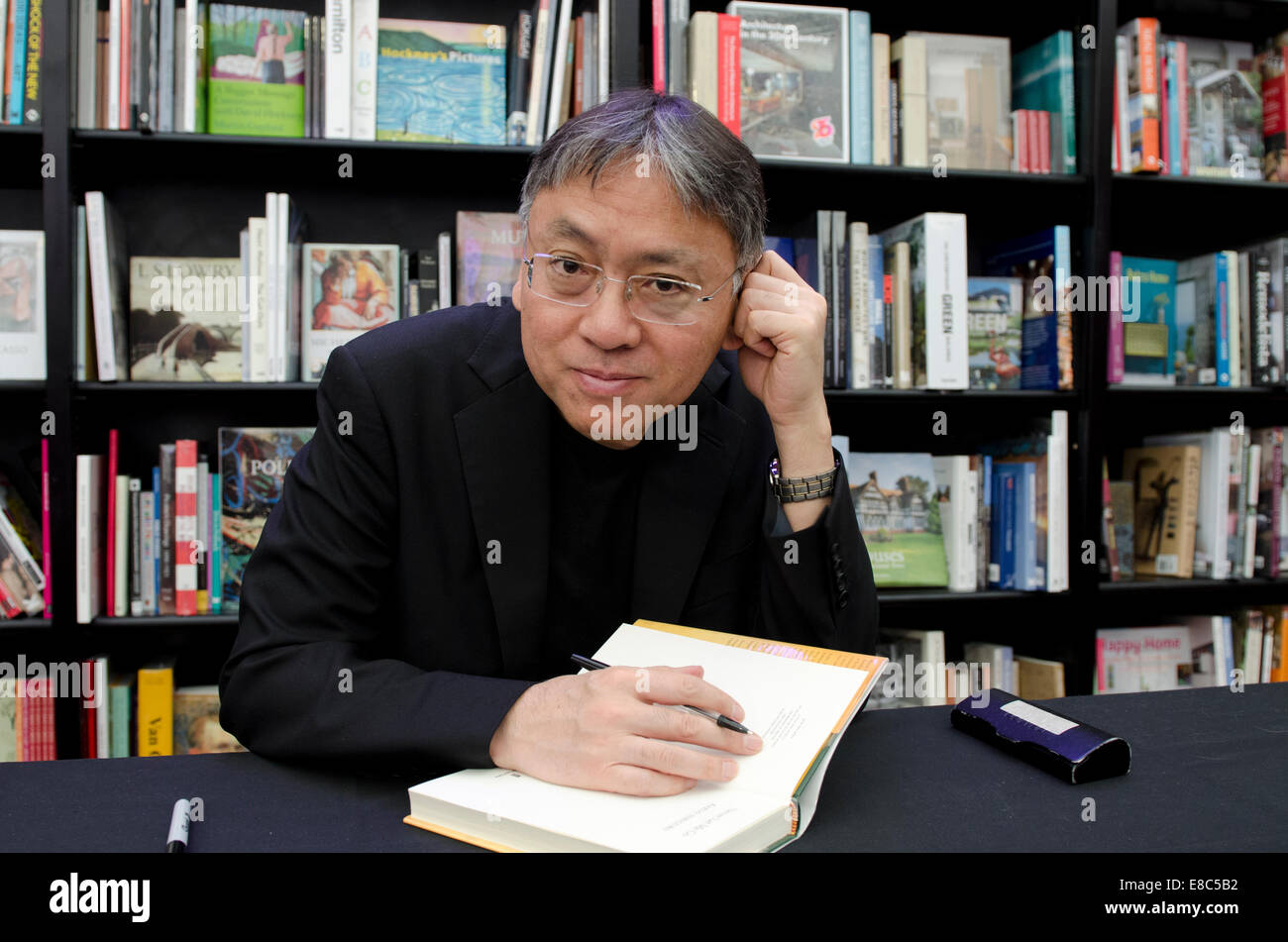 Kazuo Ishiguro, novelist, signs books at the Cheltenham Literary Festival, Gloucestershire, Uk  4th October 2014 Credit:  Prixnews/Alamy Live News Stock Photo