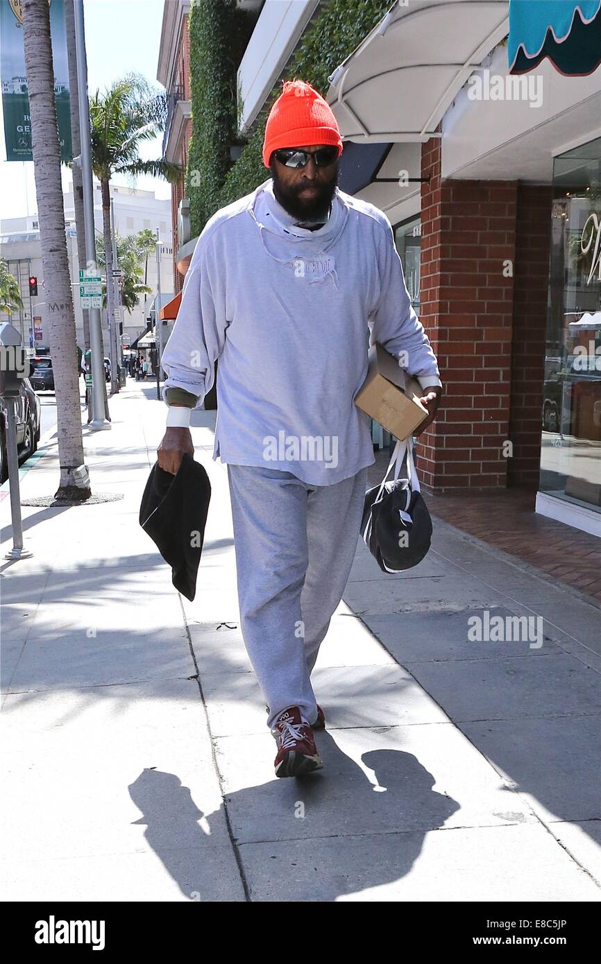 Mister T hands over a 'Mr T in your pocket' to a fan while out and about in Beverly Hills  Featuring: Mister T Where: Los Angeles, California, United States When: 01 Apr 2014 Stock Photo