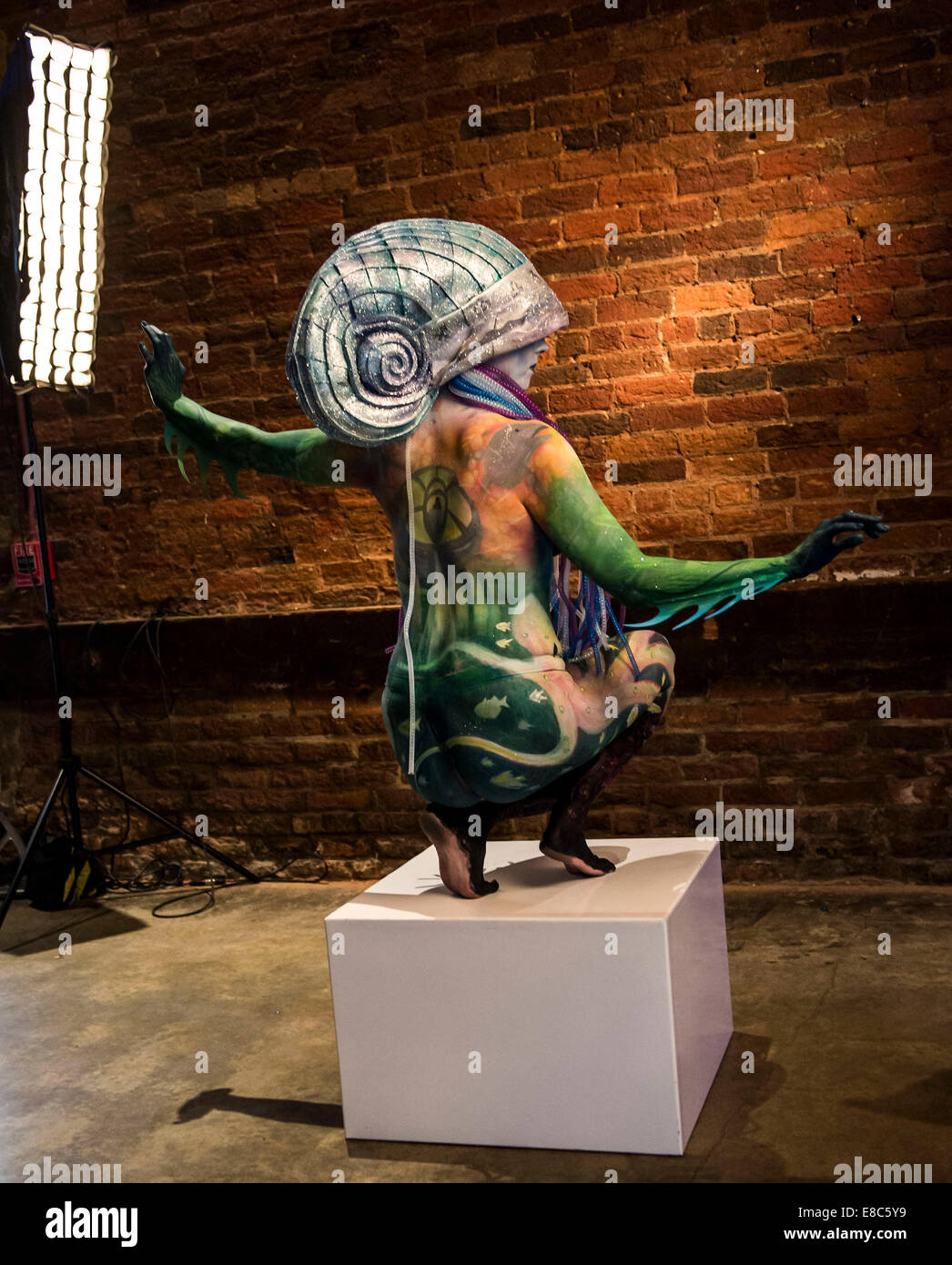 Model poses during body painting hi-res stock photography and images ...