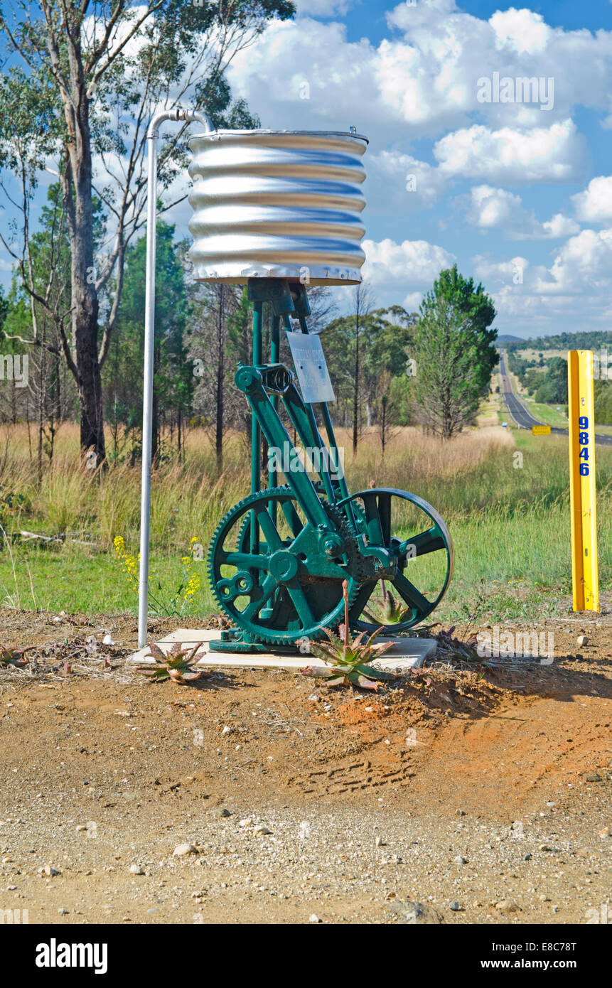 Roadside mailbox using old water pump  fitted with corrugated iron tank Stock Photo