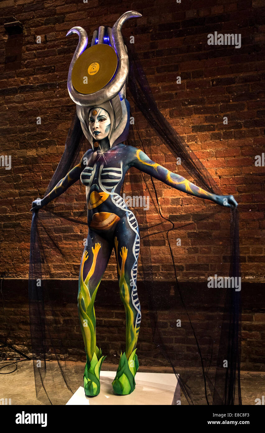 Model poses during body painting hi-res stock photography and images ...