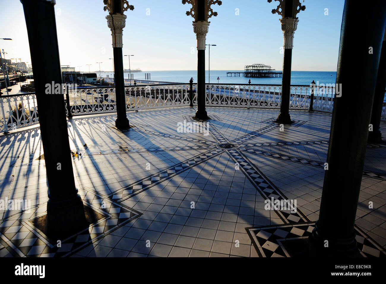 Brighton, Sussex, UK. Early morning sunshine on Brighton bandstand with the West Pier in the background  Credit:  Simon Dack/Alamy Live News Stock Photo