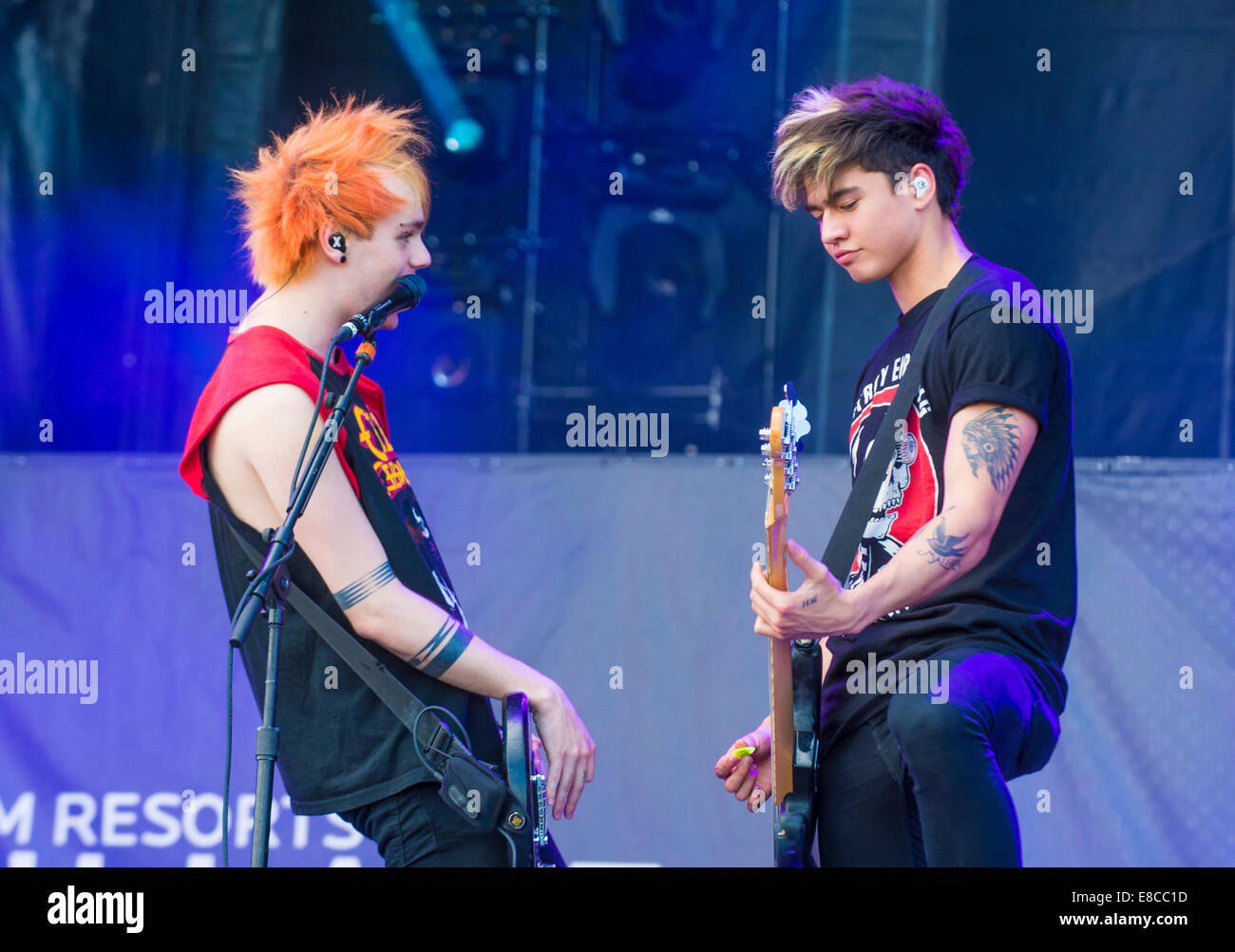 Rock band 5 Seconds of Summer performs on stage at the 2014 iHeartRadio Music Festival Village in Las Vegas. Stock Photo