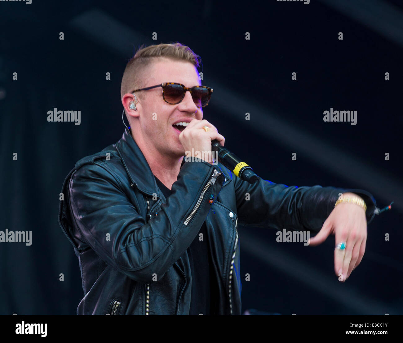 Rapper Macklemore Rapper Macklemore performs on stage at the 2014 iHeartRadio Music