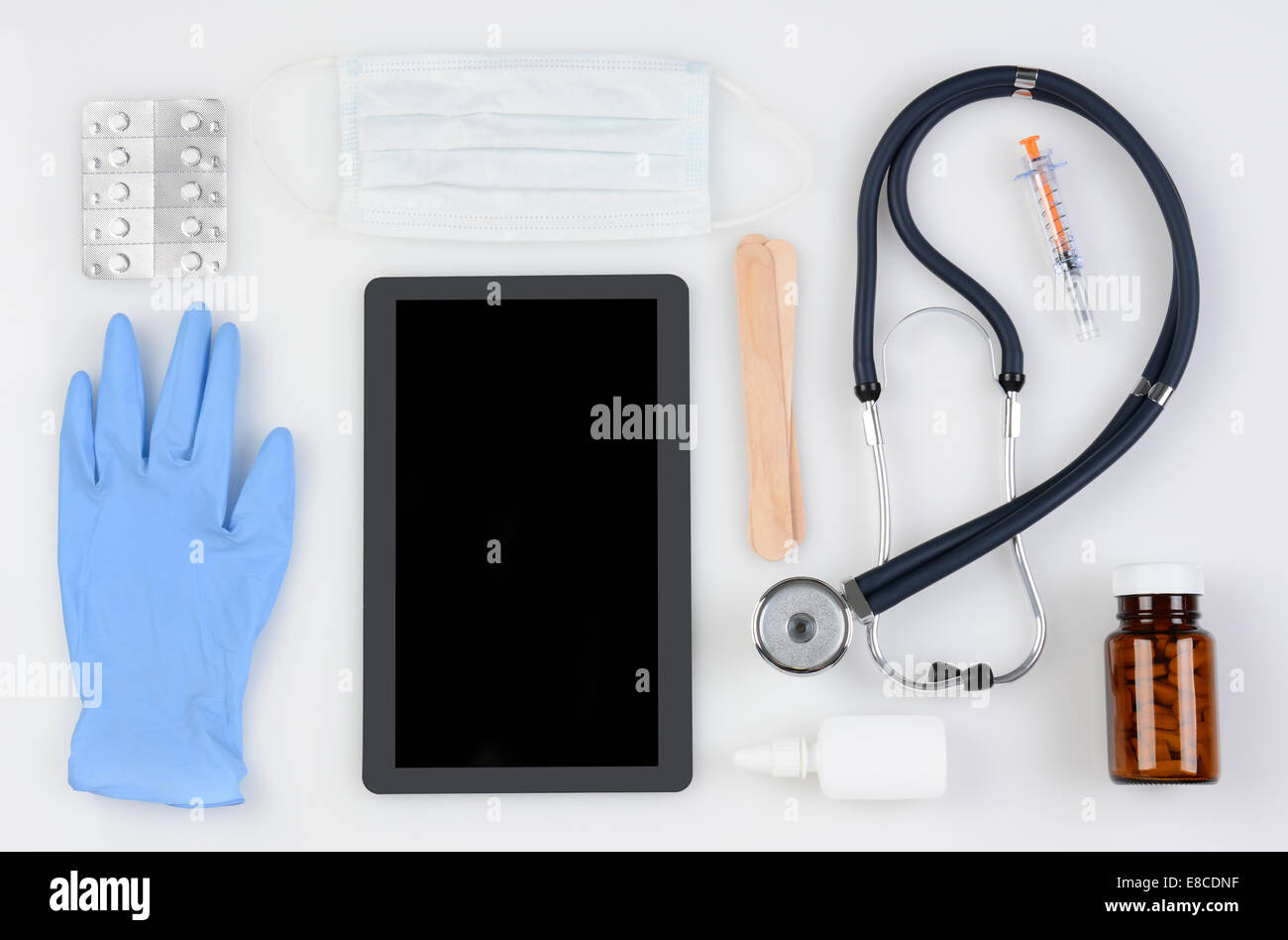 High angle shot of a group of medical / health care related items including: Stethoscope, tongue depressors, latex glove, medici Stock Photo