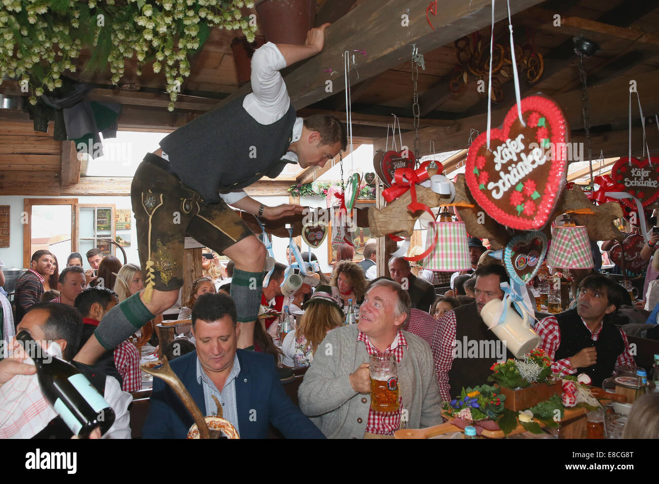Munich, Germany. 5th Oct, 2014.  Manuel Neuer attends the Oktoberfest beer festival at Kaefer Wiesnschaenke tent at Theresienwiese on October 5, 2014 in Munich, Germany.    Manuel Neuer Credit:  kolvenbach/Alamy Live News Stock Photo