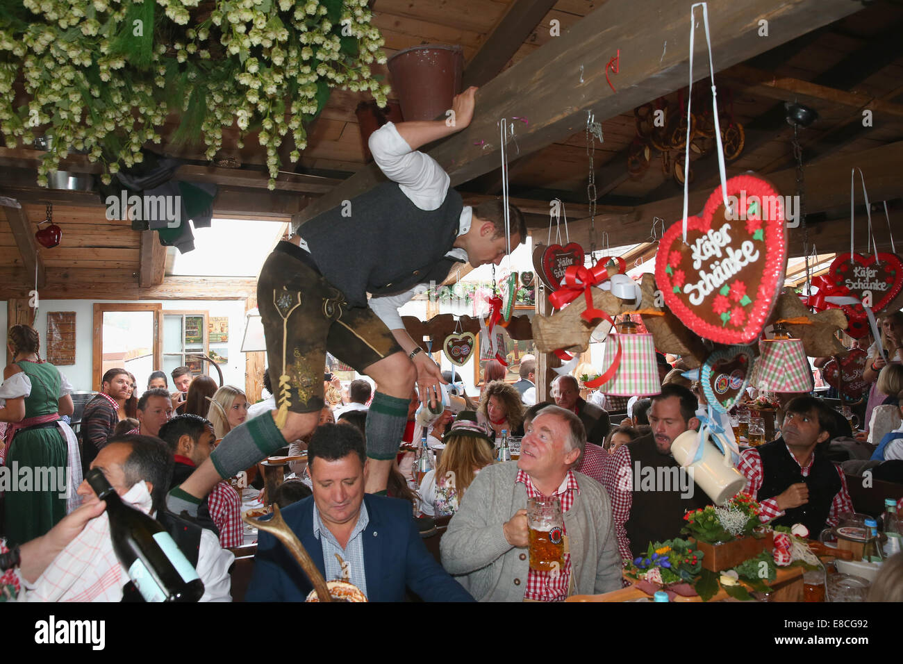 Munich, Germany. 5th Oct, 2014.  Manuel Neuer attends the Oktoberfest beer festival at Kaefer Wiesnschaenke tent at Theresienwiese on October 5, 2014 in Munich, Germany.    Manuel Neuer Credit:  kolvenbach/Alamy Live News Stock Photo
