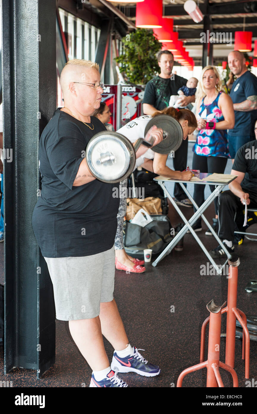 Female participant performing the strict curl at the Dutch grand prix strict curl at Amersfoort, the Netherlands on september 13 Stock Photo