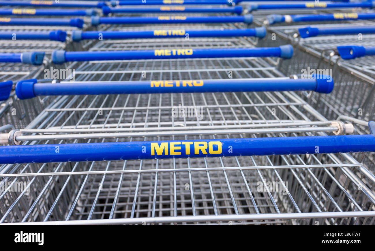Large empty blue shopping cart Metro store. Metro Group is a German