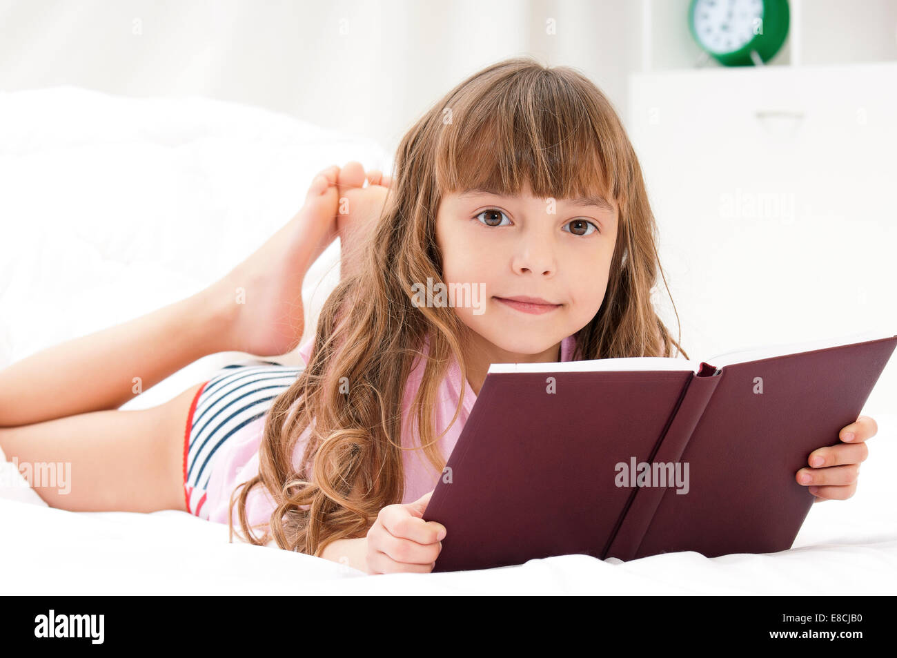 Girl on bed Stock Photo Alamy