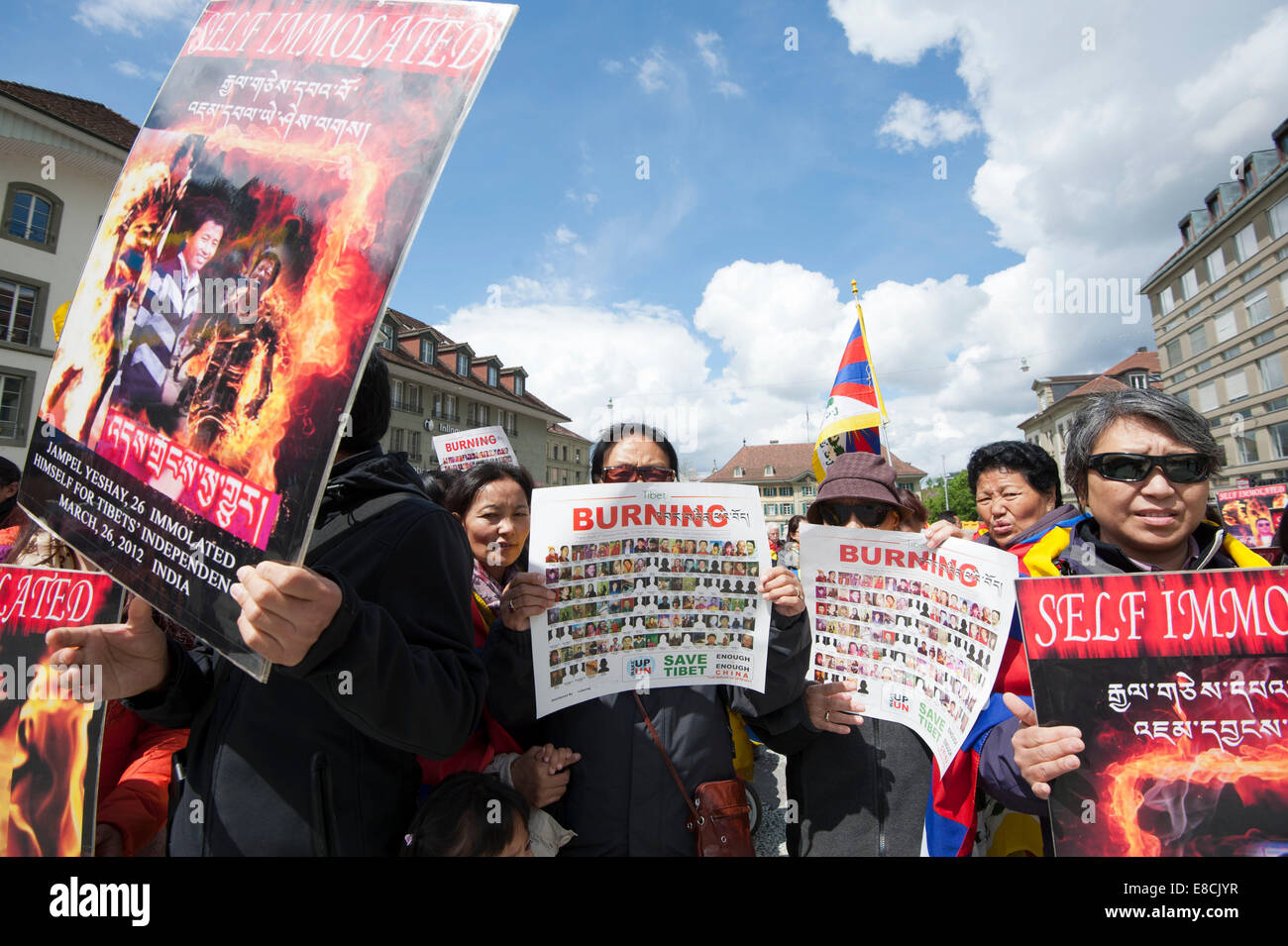 Tibetans are holding up posters and flags at a  protest rally during the visit of China's Premier Li Keqiang in Bern,Switzerland Stock Photo