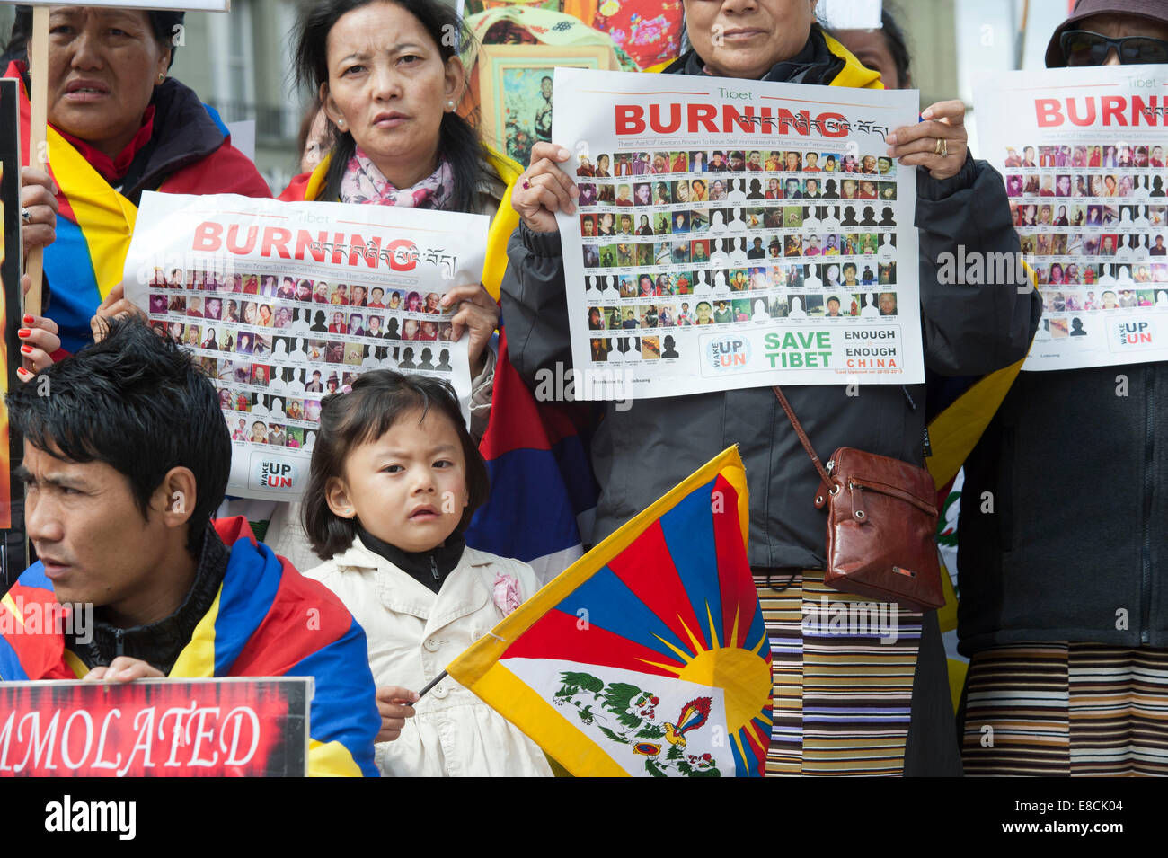 A little Tibetan girl is handling her flag at a protest rally of exile Tibetans in Bern, Switzerland Stock Photo