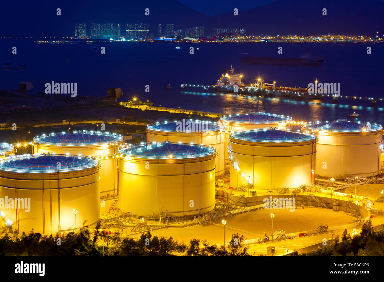 Big Industrial oil tanks in a refinery at night Stock Photo Alamy