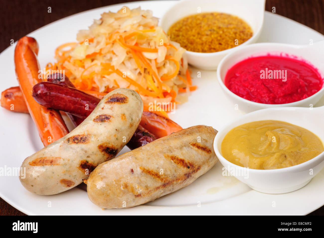 German sausage with cabbage and sauces Stock Photo Alamy
