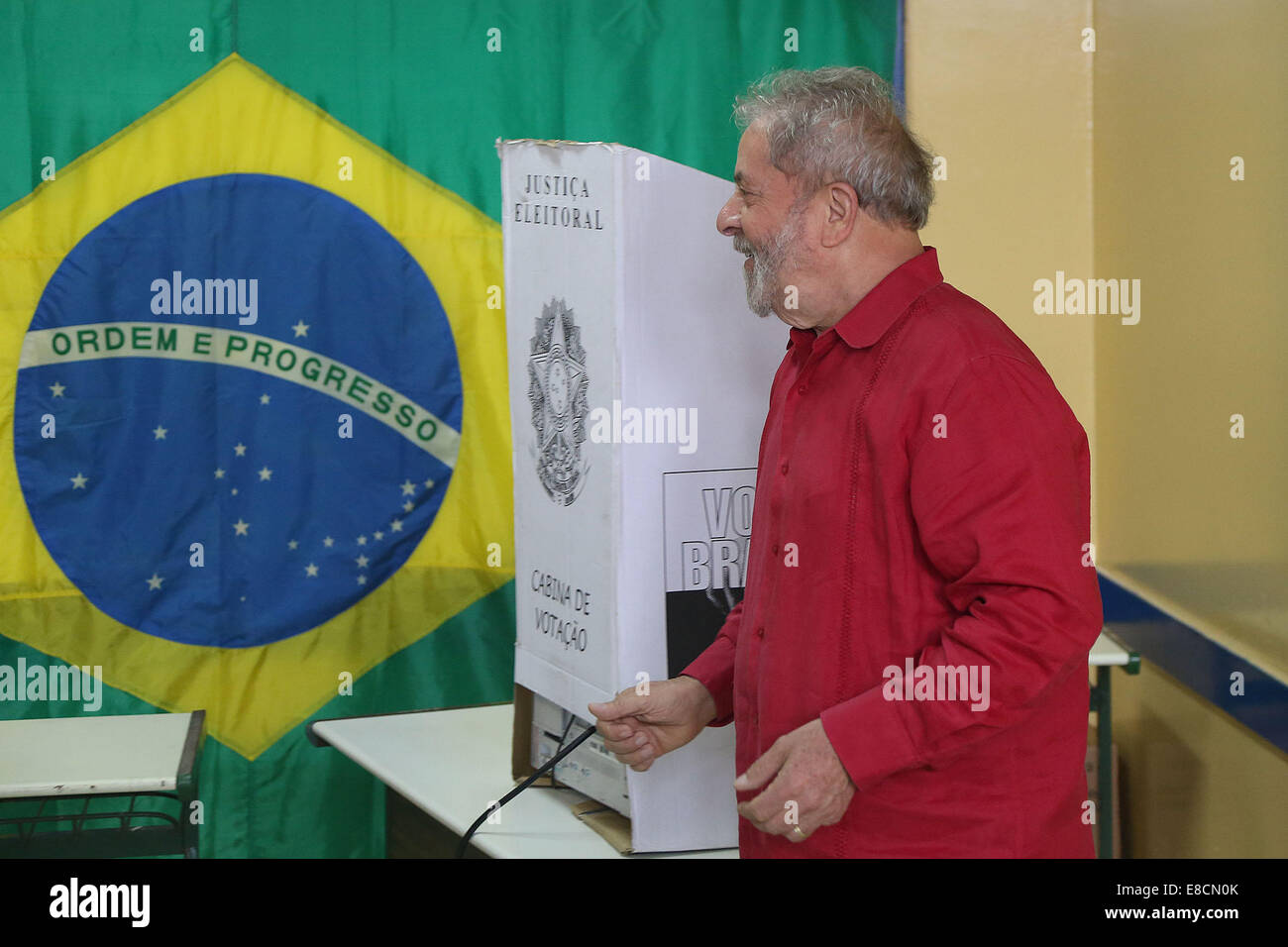 Sao Paulo, Brazil. 5th Oct, 2014. The former Brazilian President, Luiz Inacio Lula da Silva, reacts after casting his ballot at a polling center in Sao Bernado do Campo, on the outskirts of Sao Paulo, Brazil, on Oct. 5, 2014. Millions of Brazilians on Sunday morning began to cast their votes in the first round of general elections for a new president, state governors and national as well as state legislators. Credit:  Rahel Patrasso/Xinhua/Alamy Live News Stock Photo