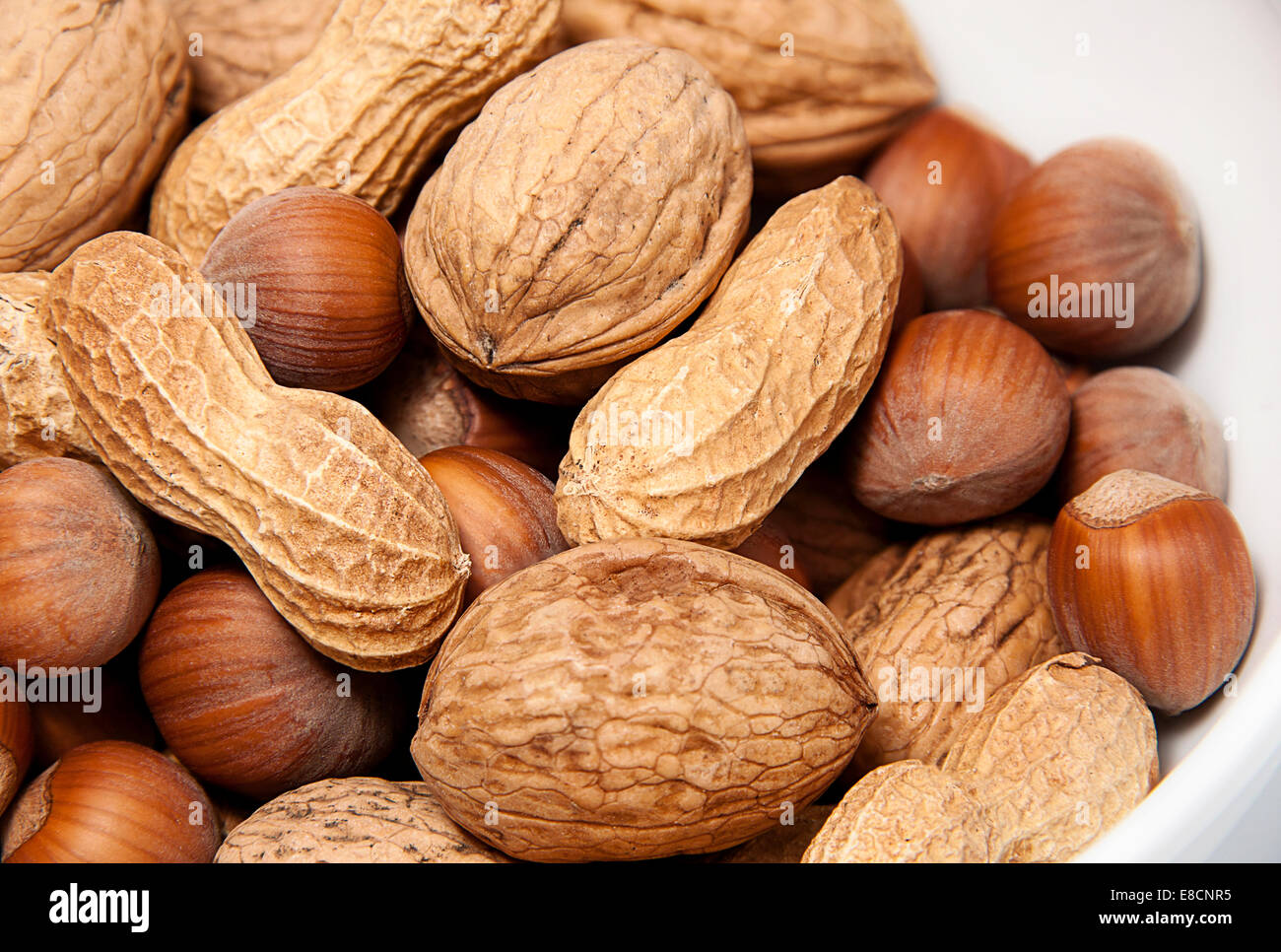 mixed nuts hazelnuts, walnuts and peanuts Stock Photo Alamy
