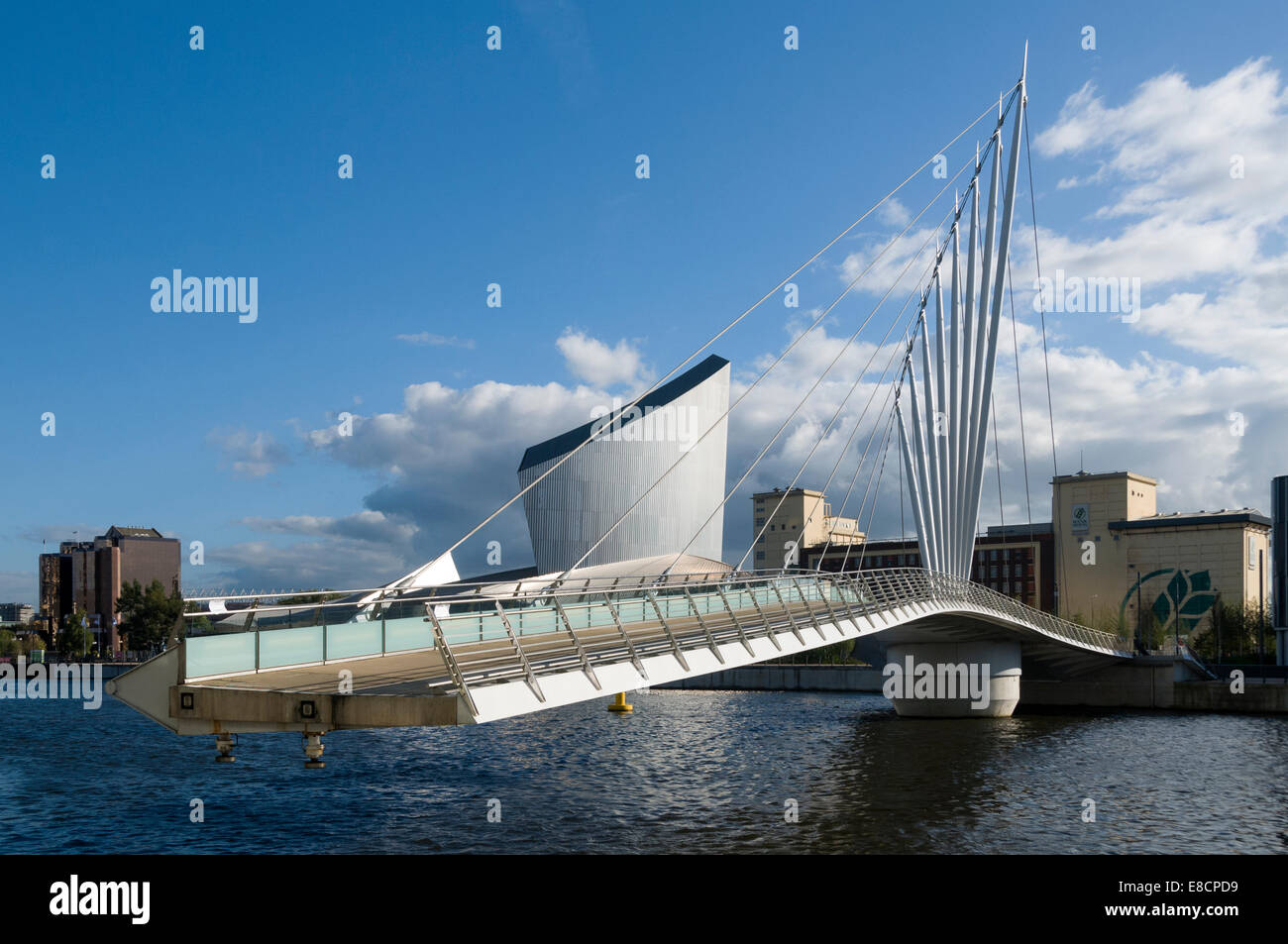 Imperial War Museum North with the MediaCityUK swing bridge about to close, Salford Quays, Manchester, England, UK Stock Photo