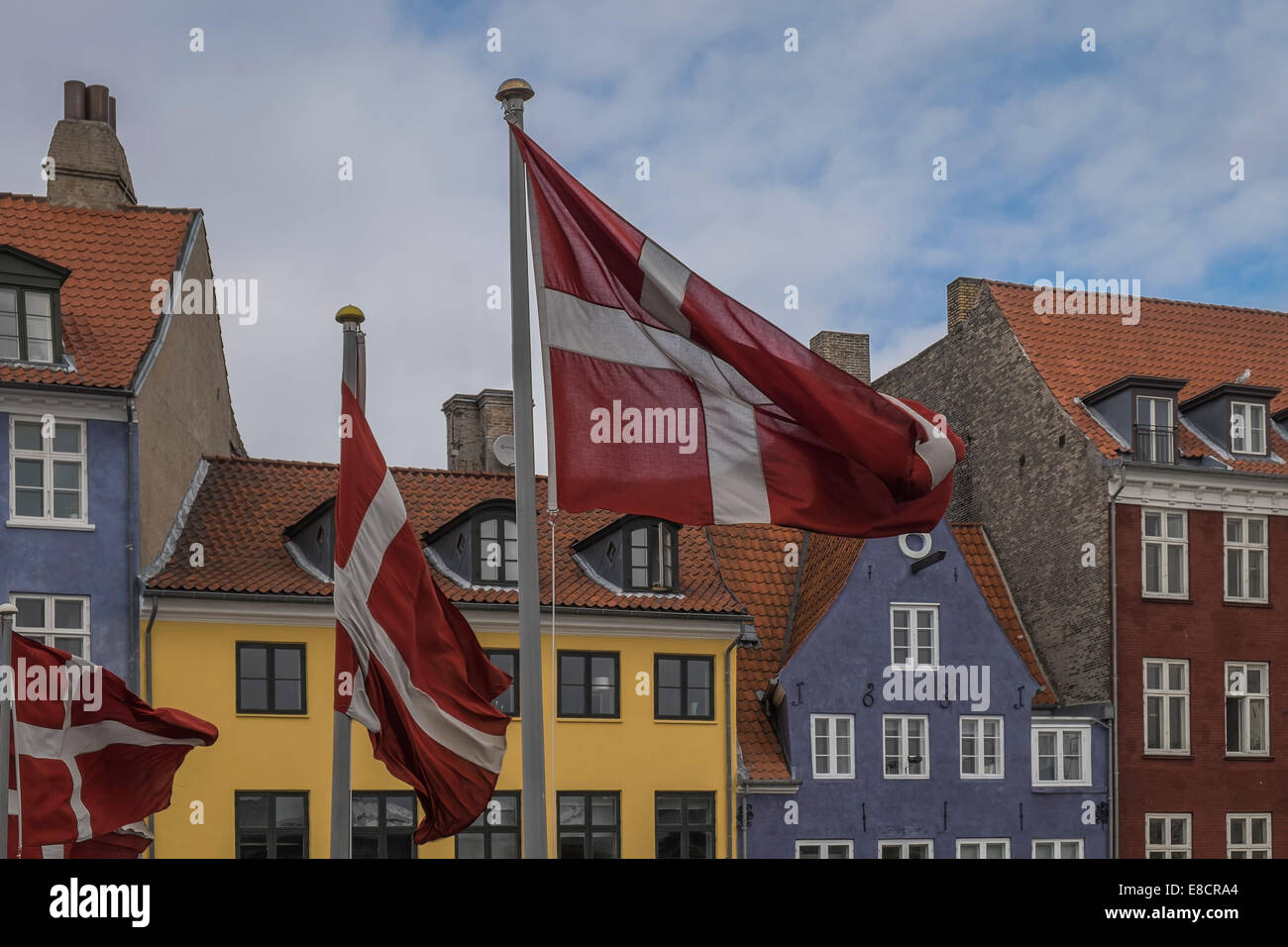 Danish flags flying in Nyhavn, Copenhagen Stock Photo