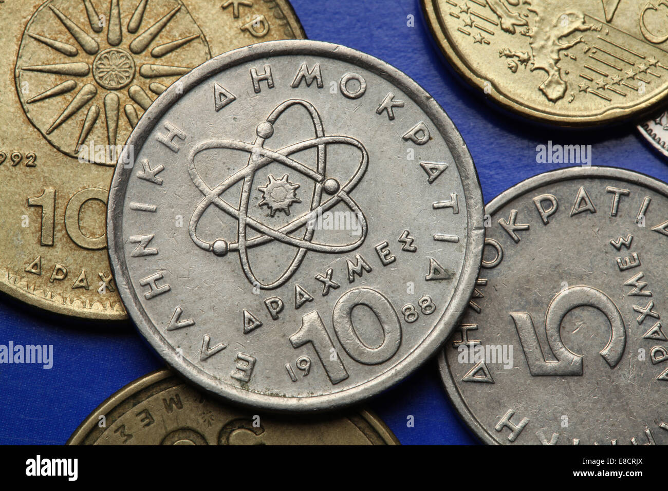 Coins of Greece. Atom, electron and neutron depicted in the old Greek 10 drachma coin. Stock Photo