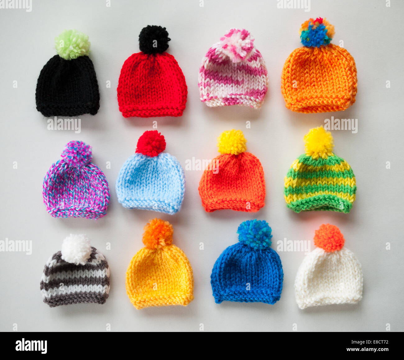 Miniature knitted hats Stock Photo