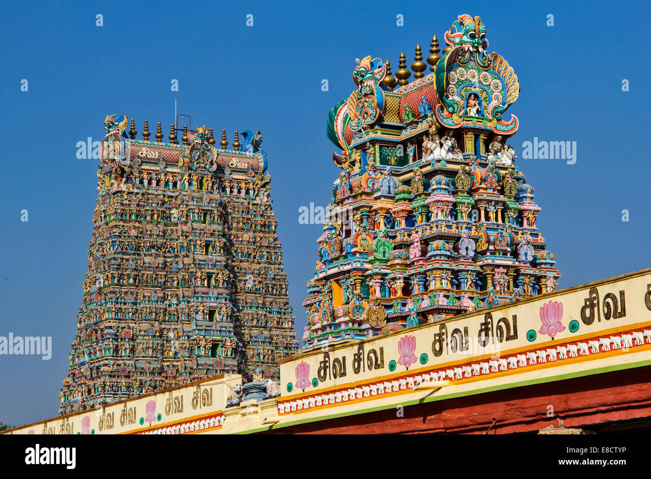 MEENAKSHI AMMAN TEMPLE MADURAI INDIA TWO OF THE HIGHLY DECORATED TOWERS Stock Photo