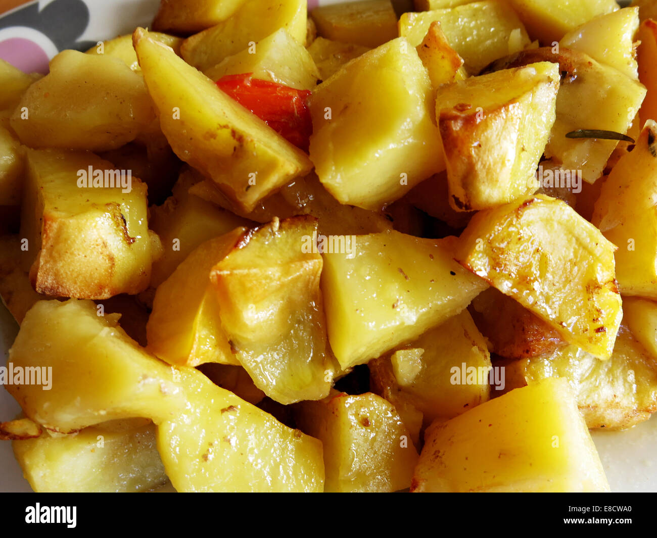 Potatoes cooked in the oven Stock Photo - Alamy