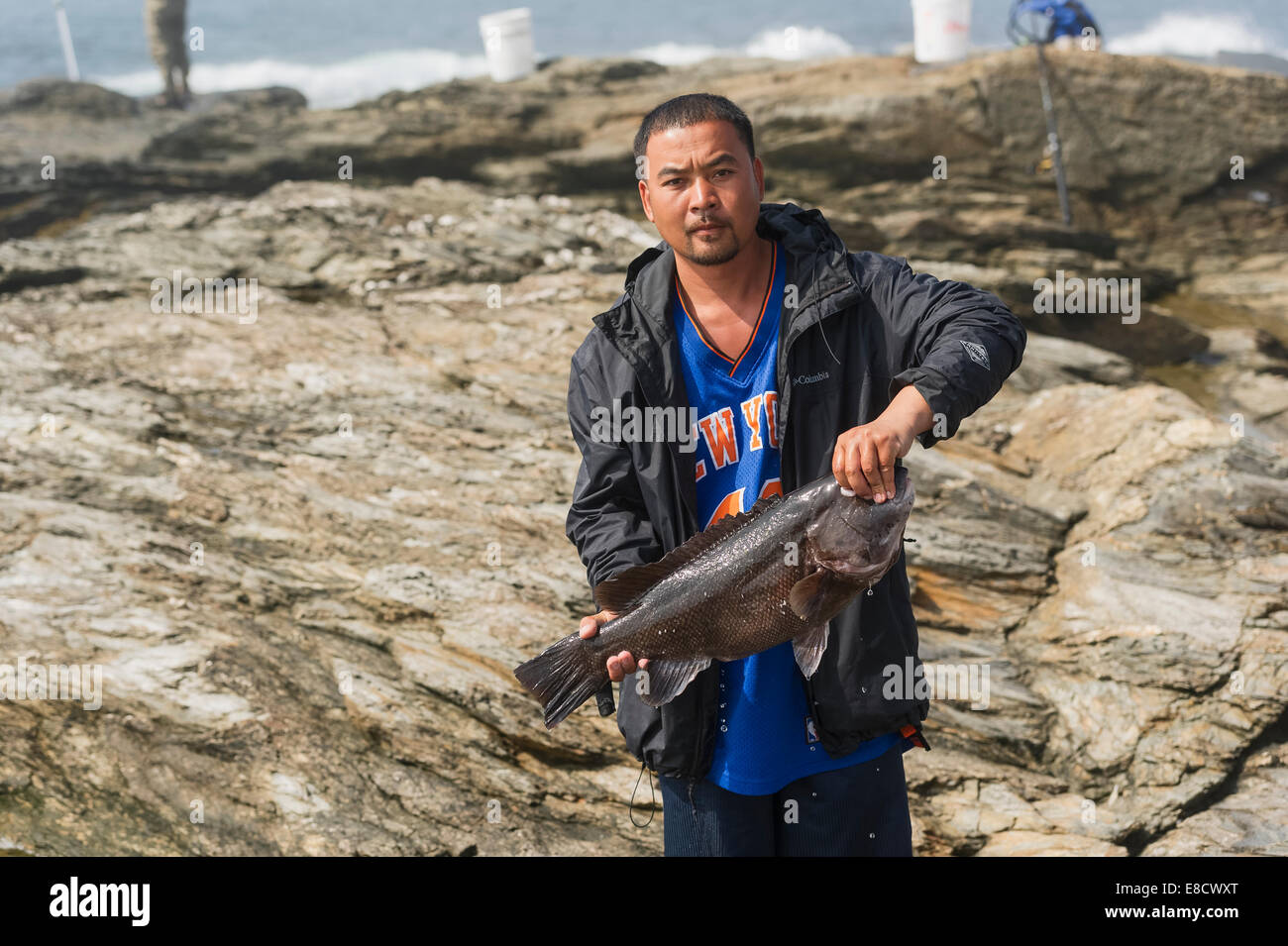 A man while fishing on the Shoreline of Point Judith, Rhode Island
