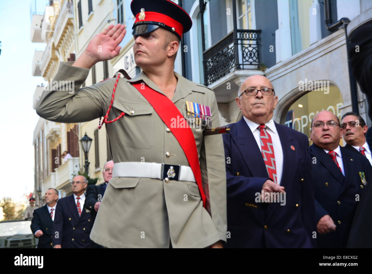 GIbraltar 5th October 2014 - The Royal Gibraltar Regiment marched through Main Street in Gibraltar, flying its full colours on Saturday 4th October. The Regiment is celebrating its 75th Anniversary. As holders of the Freedom of the City award the Regiment took the opportunity to march through Gibraltar's City Centre, saluting the Mayor and Governor. Credit:  Stephen Ignacio/Alamy Live News Stock Photo