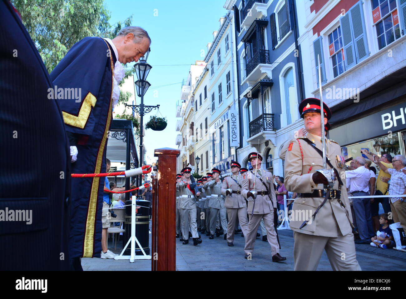 GIbraltar 5th October 2014 - The Royal Gibraltar Regiment marched through Main Street in Gibraltar, flying its full colours on Saturday 4th October. The Regiment is celebrating its 75th Anniversary. As holders of the Freedom of the City award the Regiment took the opportunity to march through Gibraltar's City Centre, saluting the Mayor and Governor. Credit:  Stephen Ignacio/Alamy Live News Stock Photo