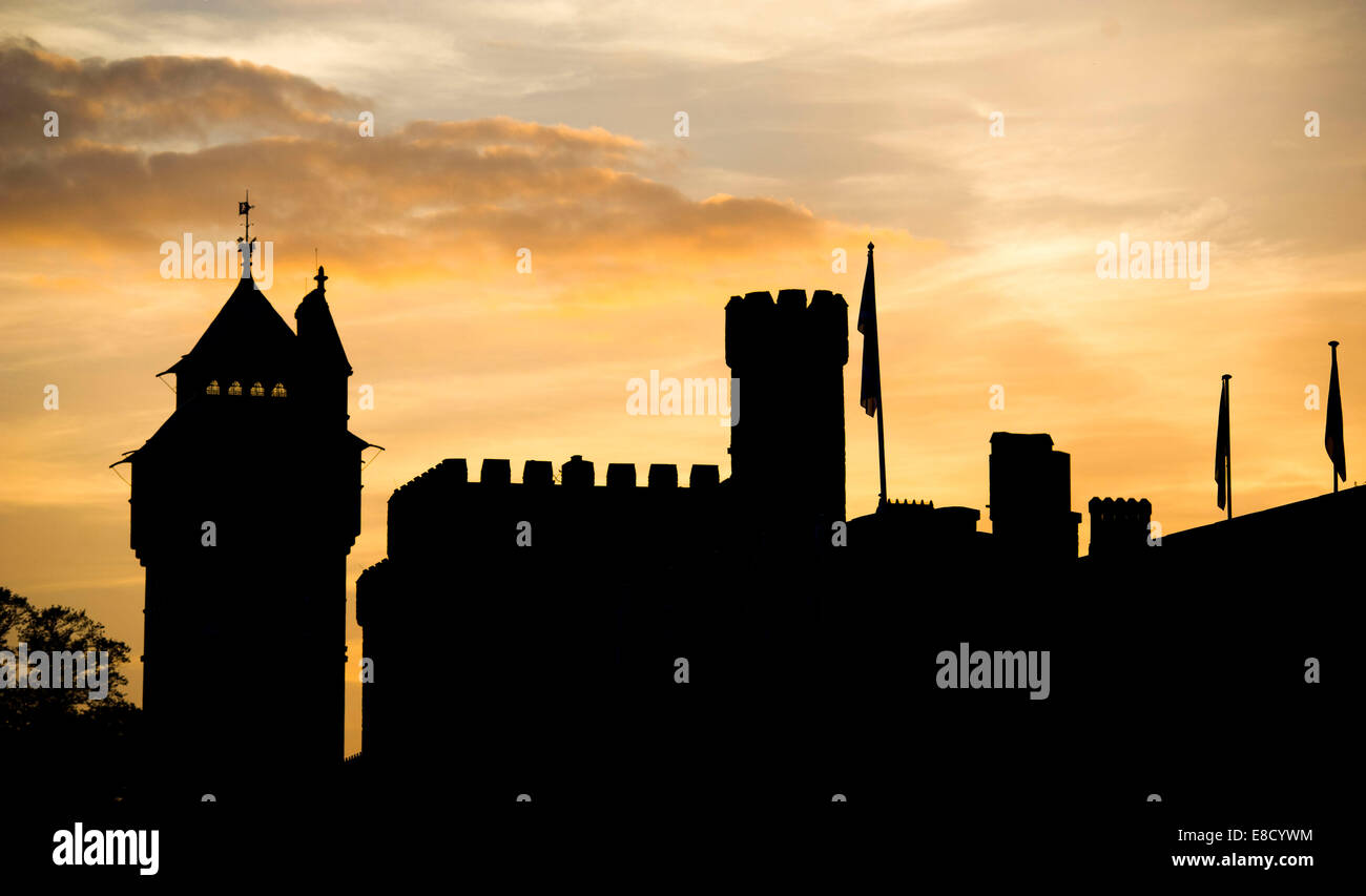 A silhouetted Cardiff Castle at sunrise. Stock Photo