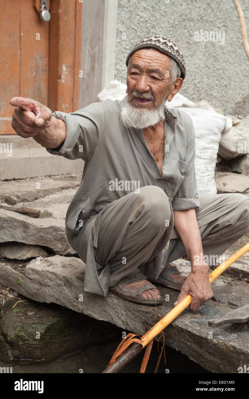 Elderly Muslim villager from Turtuk, Nubra Valley, still working at the age of 85. Ladakh, India, Stock Photo