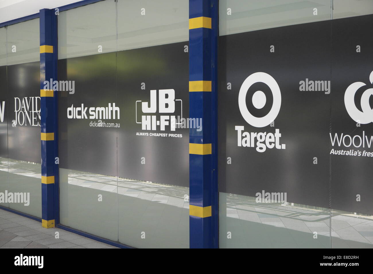 wall promoting retailers in warringah mall sydney, some of australia's major name brands for example Tartget,Woolworths,JB HIFi Stock Photo