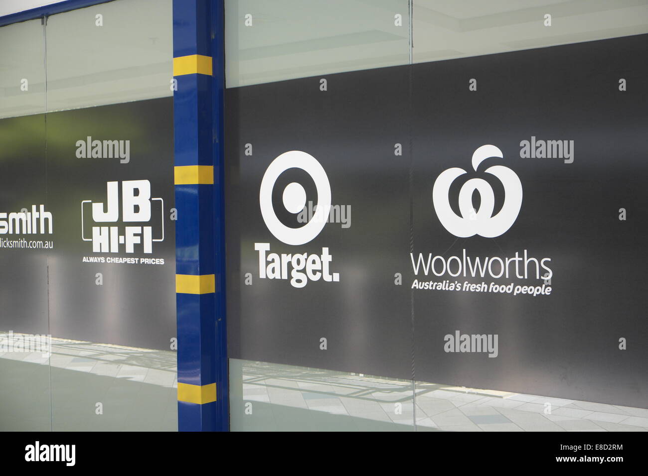 wall promoting retailers in warringah mall sydney, some of australia's major name brands for example Tartget,Woolworths,JB HIFi Stock Photo