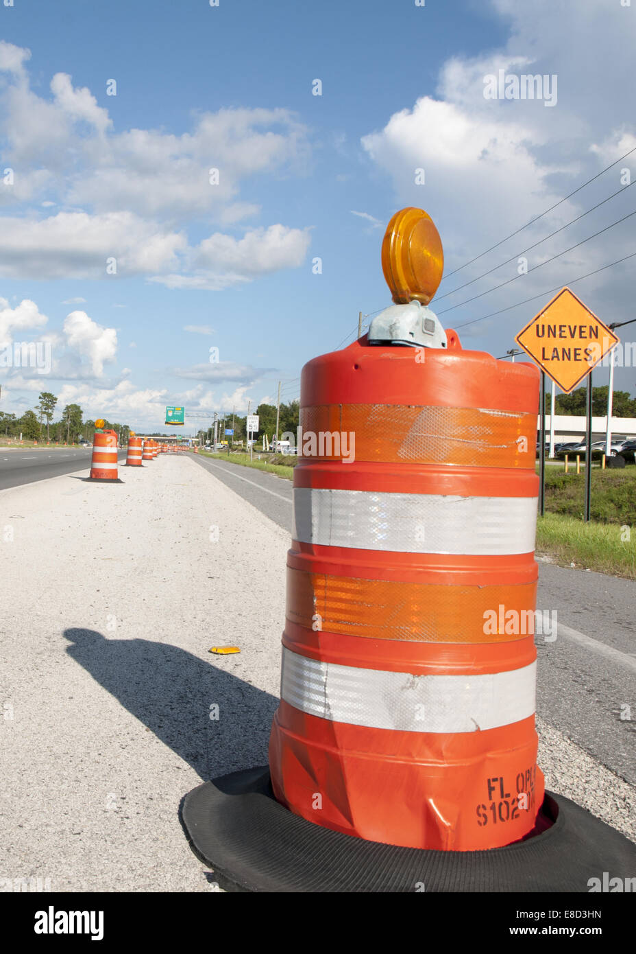Orange barrel barrier for road construction Stock Photo Alamy