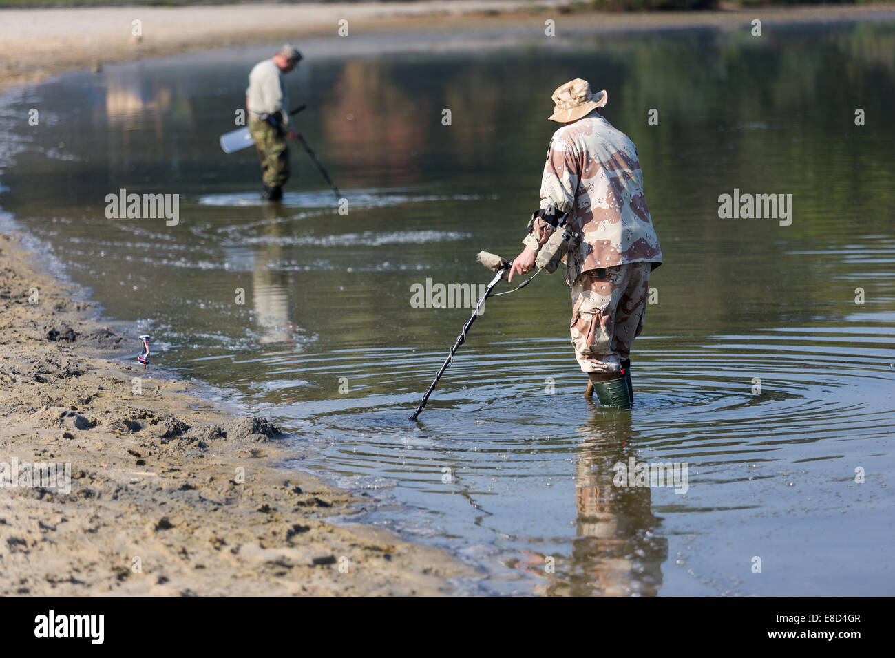 men searching for a precious metal using a metal detector, Doksy, Czech ...