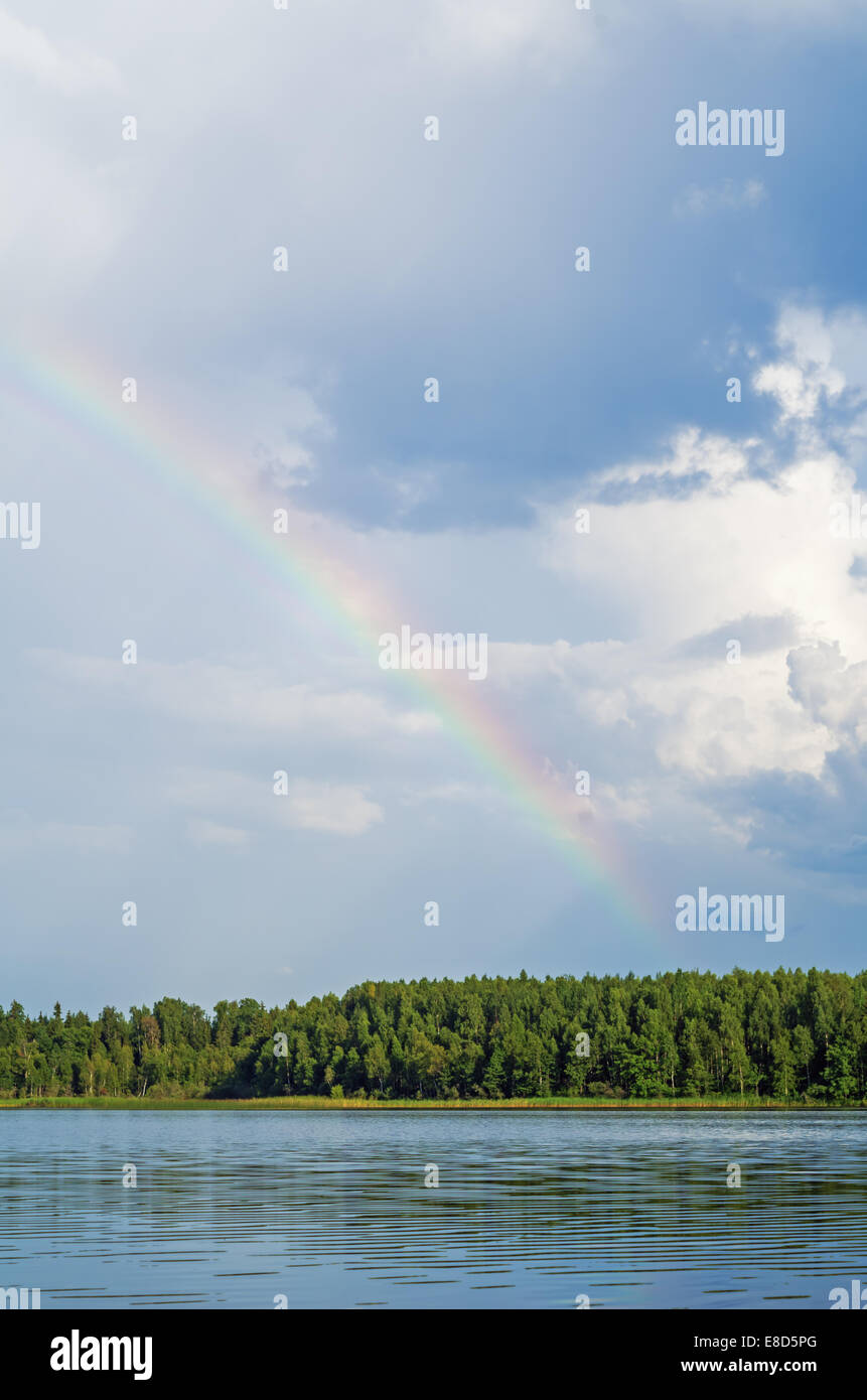 Rainbow over lake Stock Photo - Alamy
