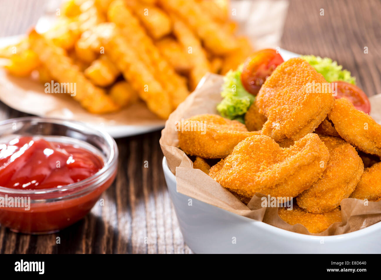 Portion of Chicken Nuggets with Chips (detailed closeup shot Stock