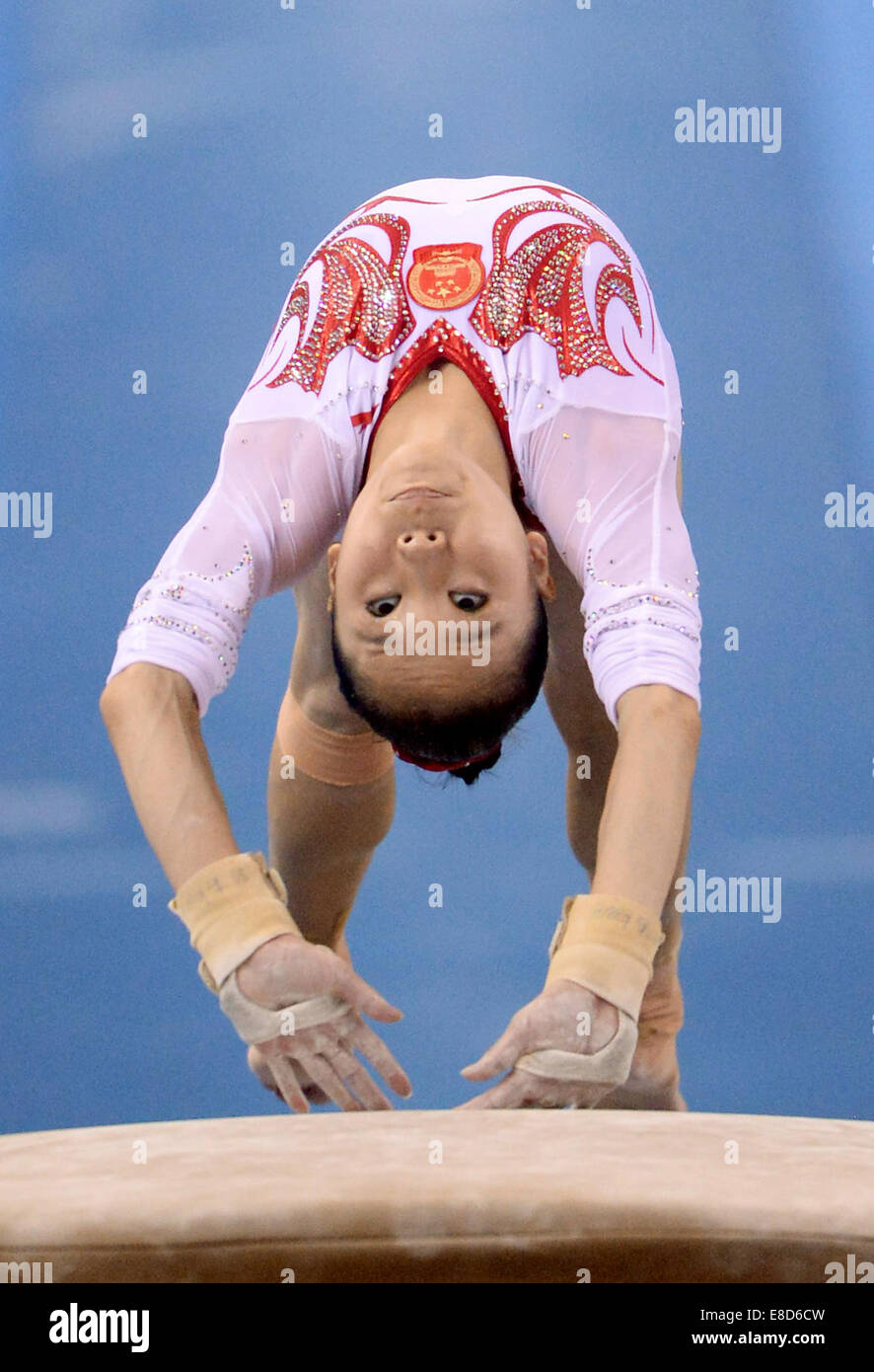 Nanning, China's Guangxi Zhuang Autonomous Region. 6th Oct, 2014. Chinese gymnast Yao Jinnan performs on the vault during the women's qualifying round of the 45th Gymnastics World Championships in Nanning, capital of south China's Guangxi Zhuang Autonomous Region, Oct. 6, 2014. The 45th FIG Artistic Gymnastics World Championships lasts from Oct. 3 to 12 in Nanning. Credit:  Chen Zixia/Xinhua/Alamy Live News Stock Photo