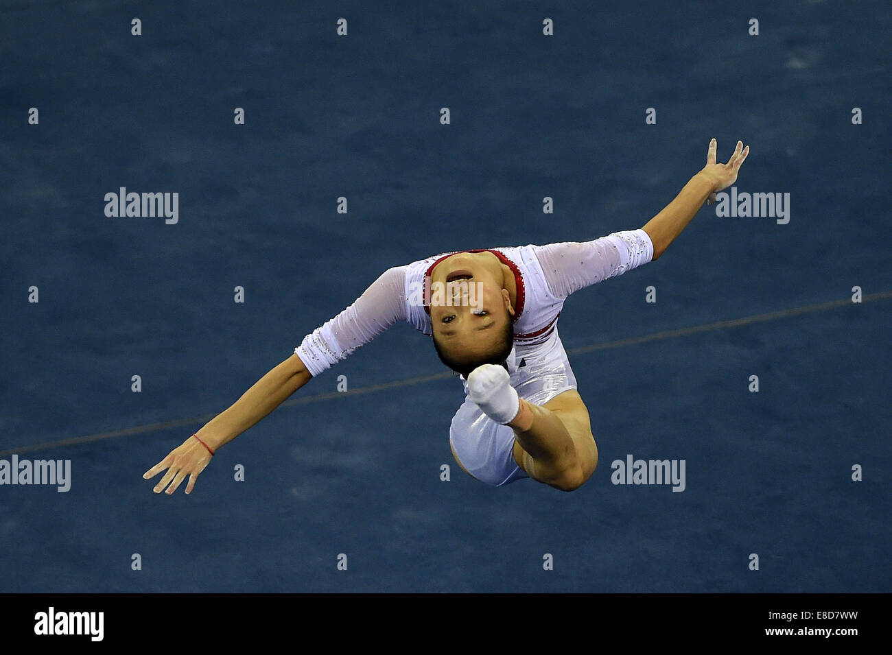 Nanning, China's Guangxi Zhuang Autonomous Region. 6th Oct, 2014. Chinese gymnast Yao Jinnan performs in the floor exercise during the women's qualifying round of the 45th Gymnastics World Championships in Nanning, capital of south China's Guangxi Zhuang Autonomous Region, Oct. 6, 2014. The 45th FIG Artistic Gymnastics World Championships lasts from Oct. 3 to 12 in Nanning. Credit:  Liu Jun/Xinhua/Alamy Live News Stock Photo