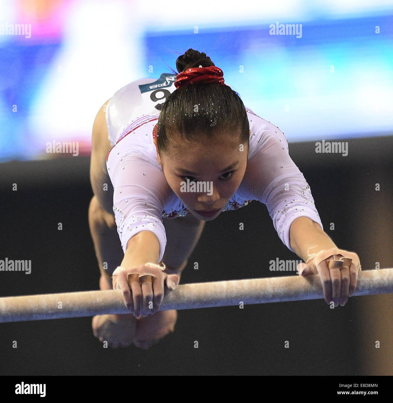 Nanning, China's Guangxi Zhuang Autonomous Region. 6th Oct, 2014. Chinese gymnast Yao Jinnan performs on the uneven bars during the women's qualifying round of the 45th Gymnastics World Championships in Nanning, capital of south China's Guangxi Zhuang Autonomous Region, Oct. 6, 2014. The 45th FIG Artistic Gymnastics World Championships lasts from Oct. 3 to 12 in Nanning. Credit:  Li Qiaoqiao/Xinhua/Alamy Live News Stock Photo